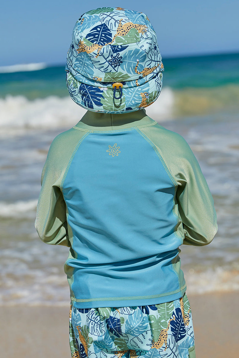Little boy wearing UV Skinz's boy's long sleeve active swim shirt in sage cool cat|sage-cool-cat