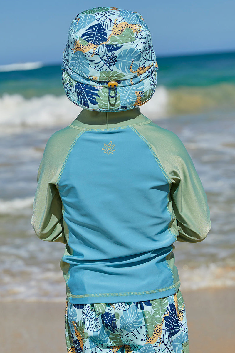 Back of a boy wearing UV Skinz's kid's adjustable flap sun hat|stained-glass