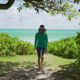 Woman wearing UV Skinz's women’s long sleeve quarter zip swim shirt