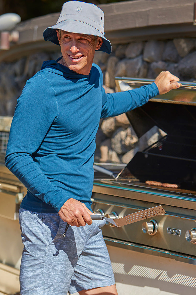 Man Grilling Hamburgers in UV Skinz's Bucket Hat|midnight-grey