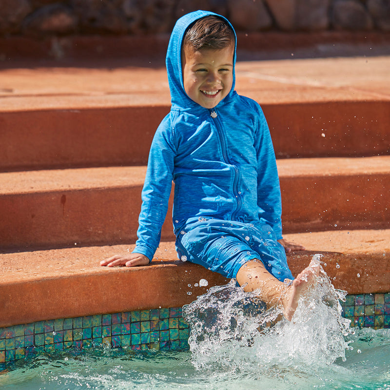 Little boy playing in the pool in UV Skinz's Boy's Zip-Up Hoodie