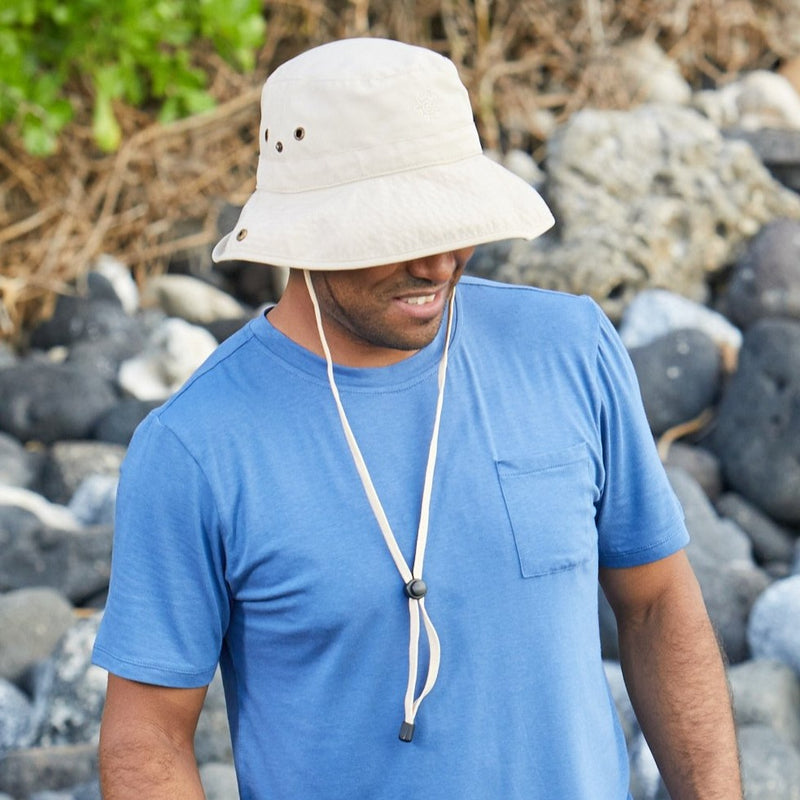 Man wearing UV Skinz's men's bucket hat with drawstring in tan cream|tan-cream