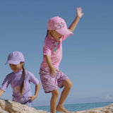 Little girls in UV Skinz's girl's short sleeve sport sun and swim shirts