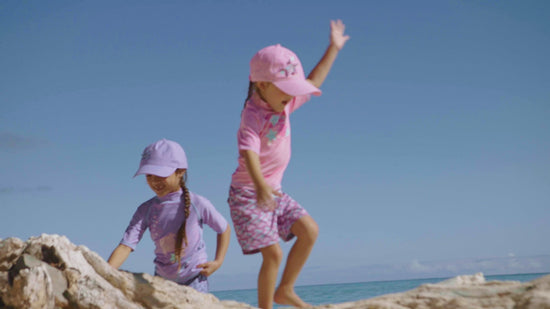 Little girls in UV Skinz's girl's short sleeve sport sun and swim shirts
