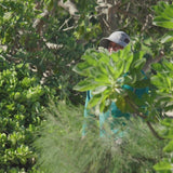 Man wearing the wide brim sun shade hat at the beach