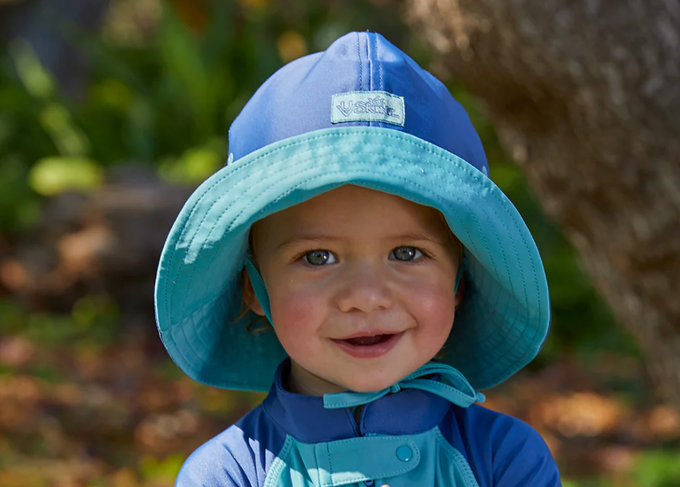 baby in UPF travel clothing