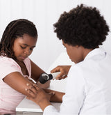 Dermatologist with a patient