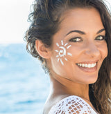 woman with sunscreen on her face
