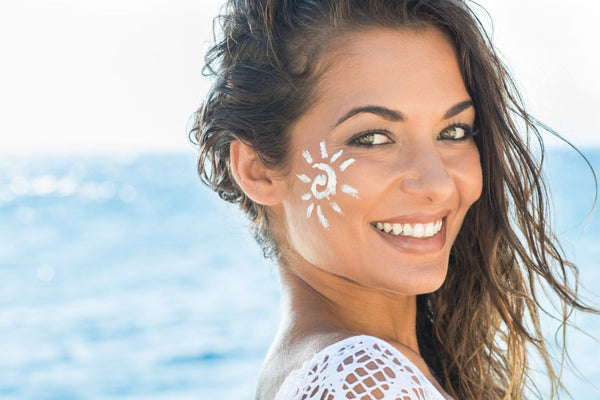 woman with sunscreen on her face