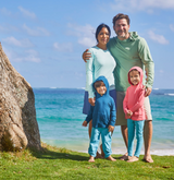 Family in UPF clothing at the beach