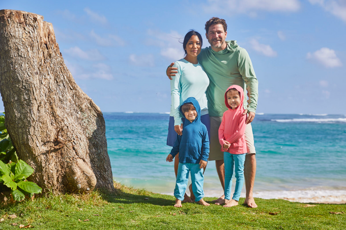 Family in UPF clothing at the beach