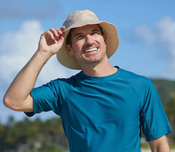 Dad wearing UV Skinz's men's bucket hat with UPF 50+