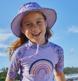 Kid in a UV Skinz's swim hat