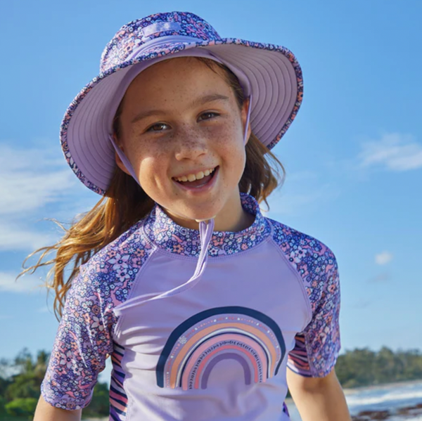 Kid in a UV Skinz's swim hat