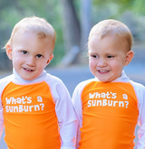 Babies in UV Skinz's What's a Sunburn Swim Shirt for Skin Cancer Awareness Month