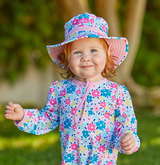 baby girl in a UV Skinz's sun hat