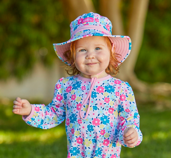 baby girl in a UV Skinz's sun hat