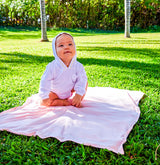 Baby on UV Skinz's UPF baby sun blanket