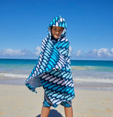 Kid in a hooded beach towel
