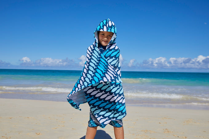 Kid in a hooded beach towel