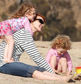 Marcia Cross with her kids wearing UV Skinz