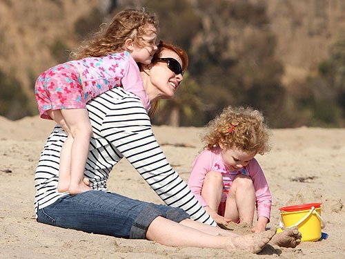 Marcia Cross with her kids wearing UV Skinz