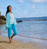 woman in a UV Skinz sun wrap on the beach