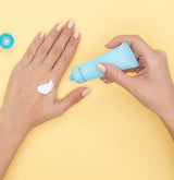 woman putting sunscreen on her hand