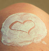 sunscreen on a woman's knee