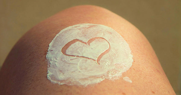 sunscreen on a woman's knee