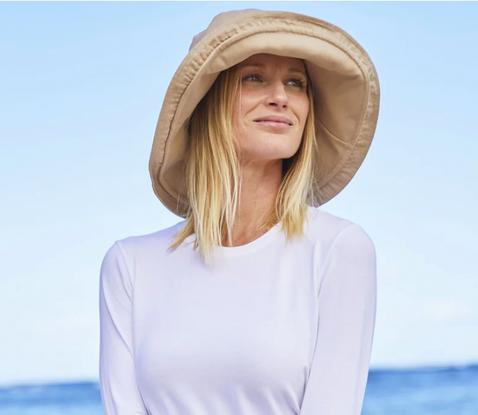 woman wearing a sun hat and UPF shirt