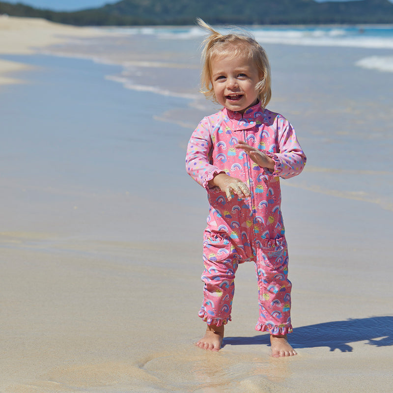 Baby girl in UV Skinz's baby girls long-sleeve swimsuit in over the rainbow|over-the-rainbow