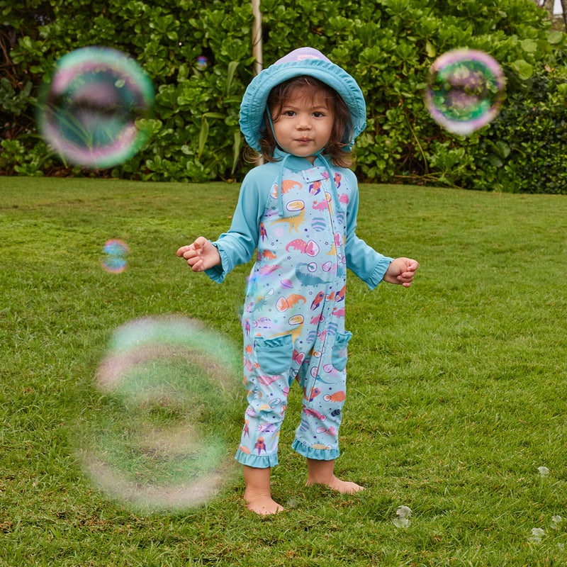 baby with bubbles in sun & swim suit|space-dinos