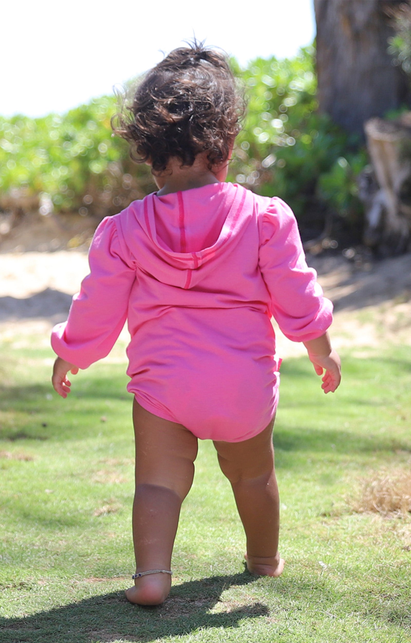 Back of a Cute Baby Girl in Baby Girl's Hooded Sunzie in Bubblegum|bubblegum
