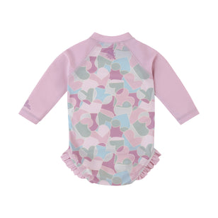 back view of baby girl long sleeve ruffle legged swim suit in puzzle hearts|puzzle-hearts