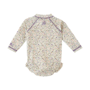 back view of baby girl long sleeve ruffle legged swim suit in sonora meadows|sonora-meadows