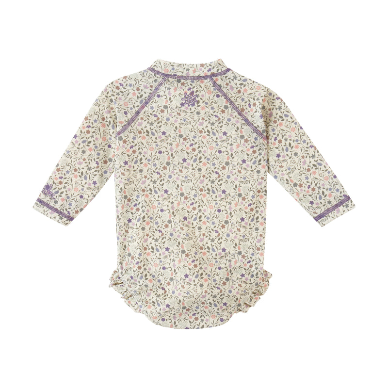 back view of baby girl long sleeve ruffle legged swim suit in sonora meadows|sonora-meadows