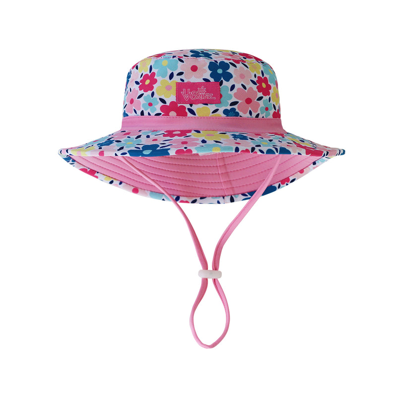 Close up of the baby girl's swim hat in colorful garden|colorful-garden