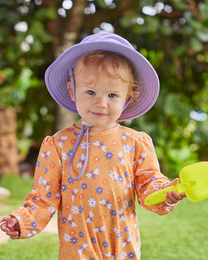 baby girl in swim hat|daybreak