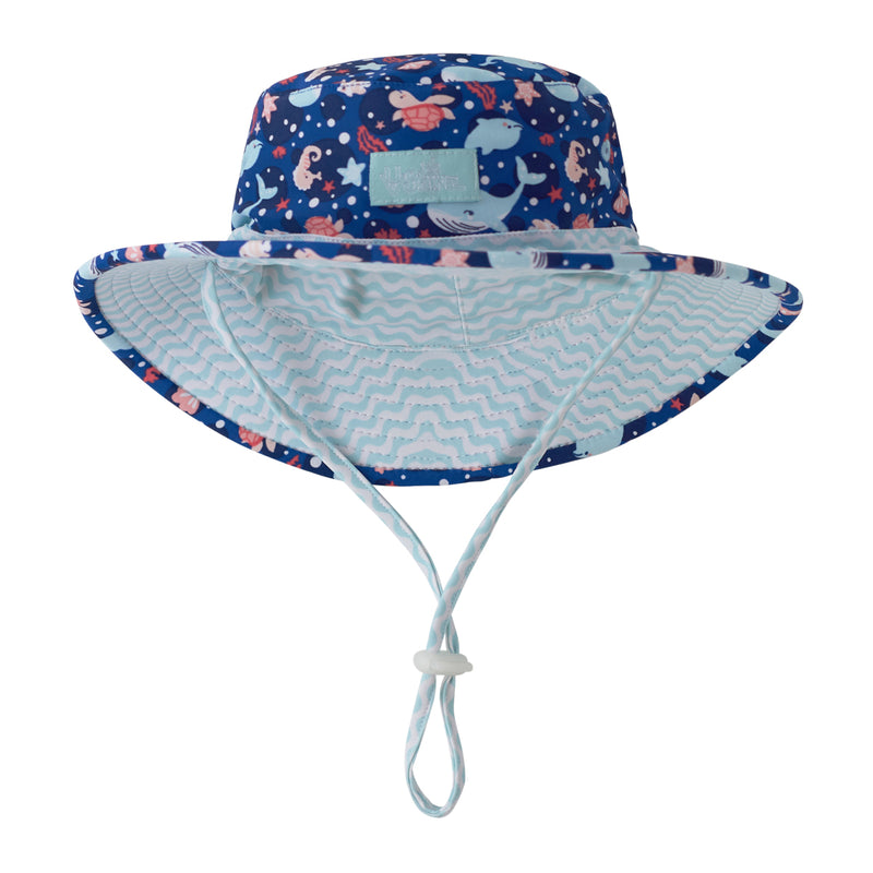 Close up of UV Skinz's baby girl's swim hat in ocean night life|ocean-night-life