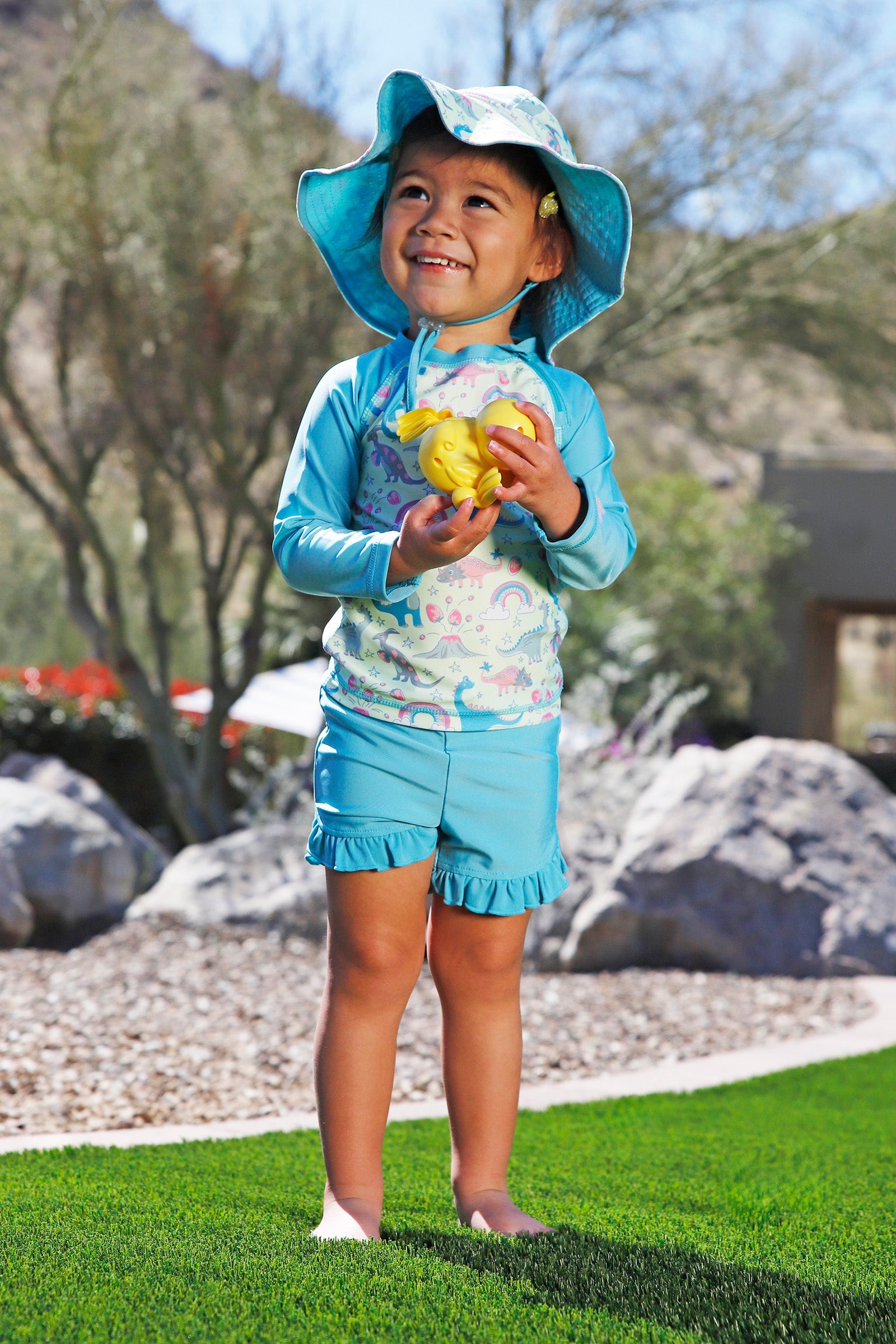 baby girl in scalloped bucket hat|dino-berry
