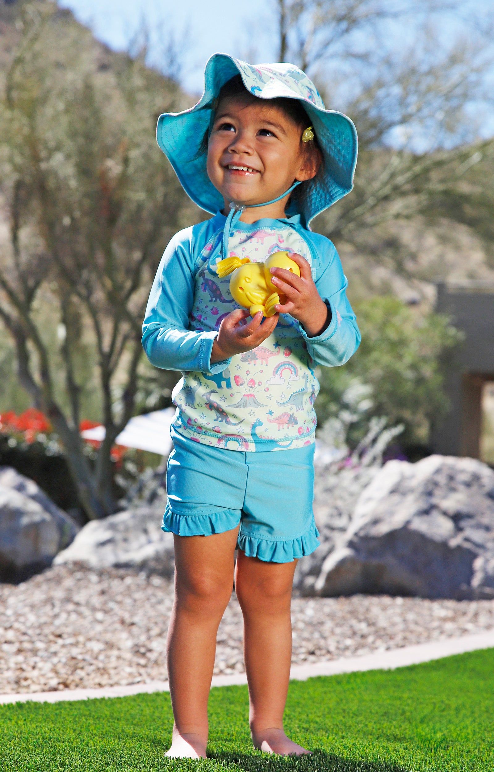 baby girl in scalloped bucket hat|colorful-wings