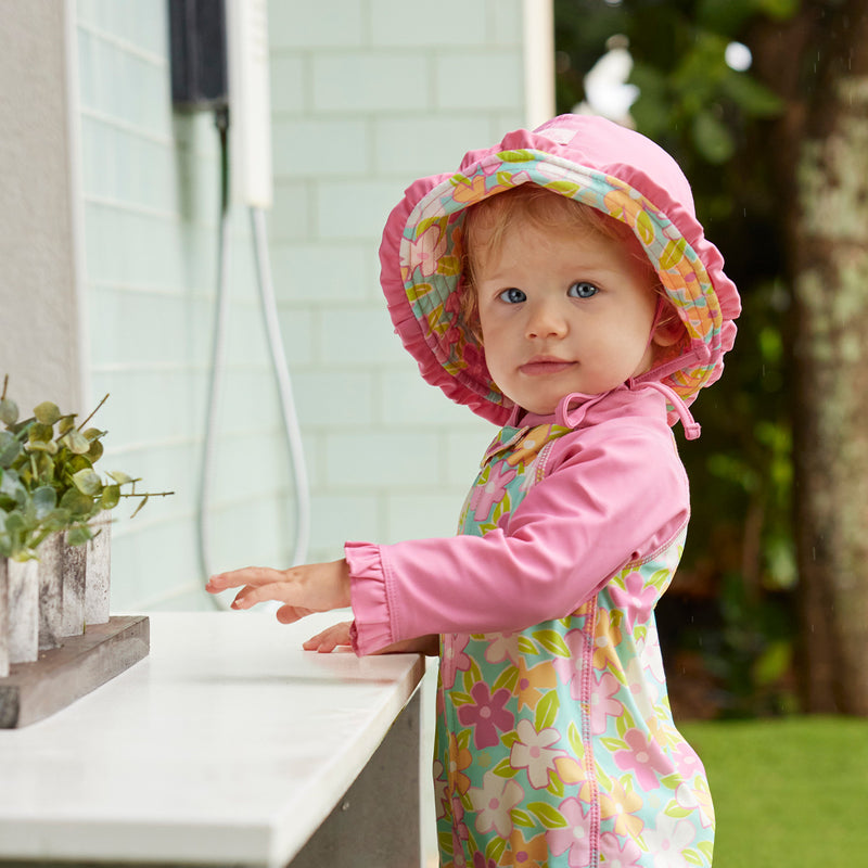 baby girl in reversible sun hat|playtime-garden