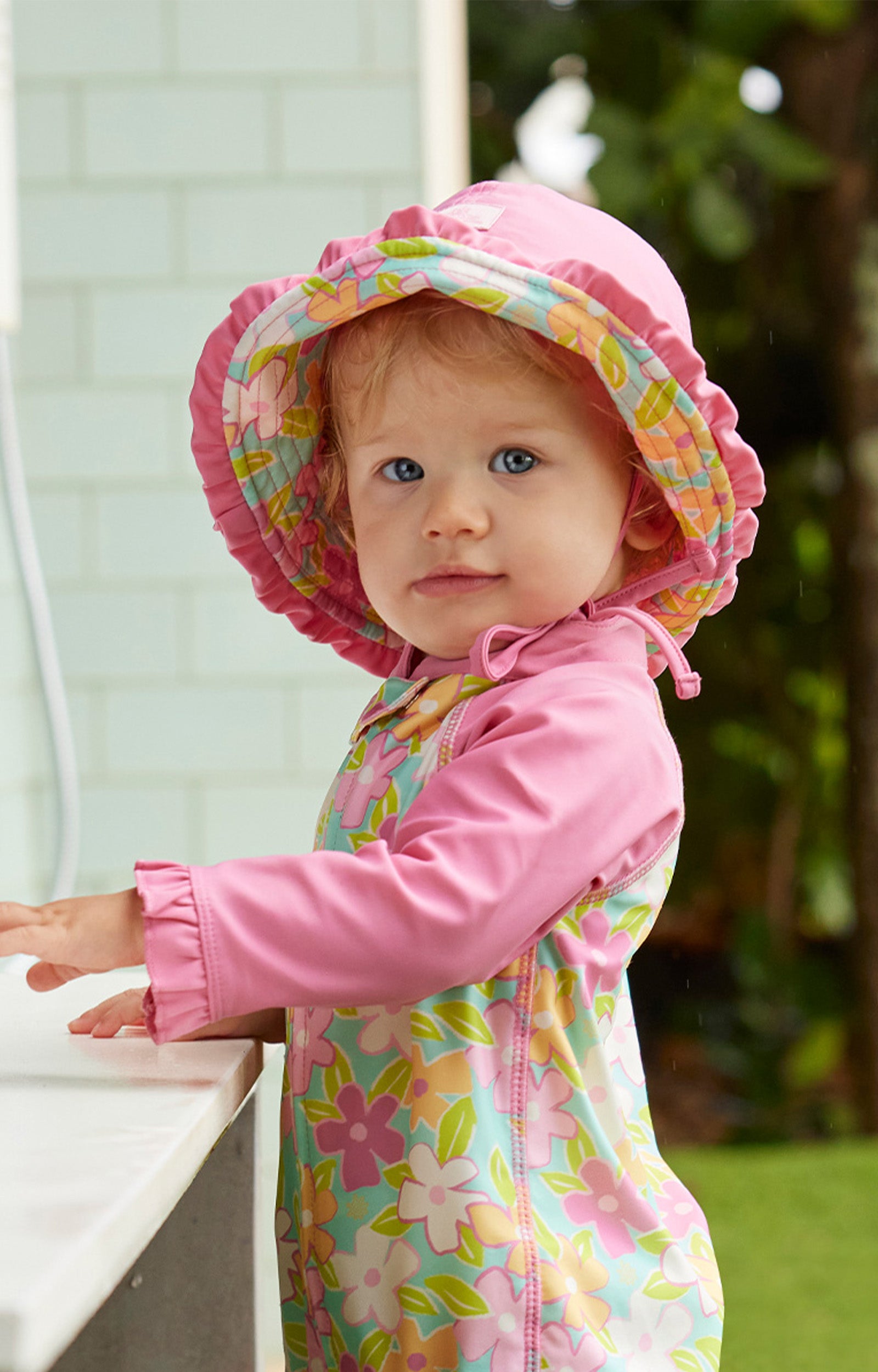baby girl in reversible sun hat|playtime-garden