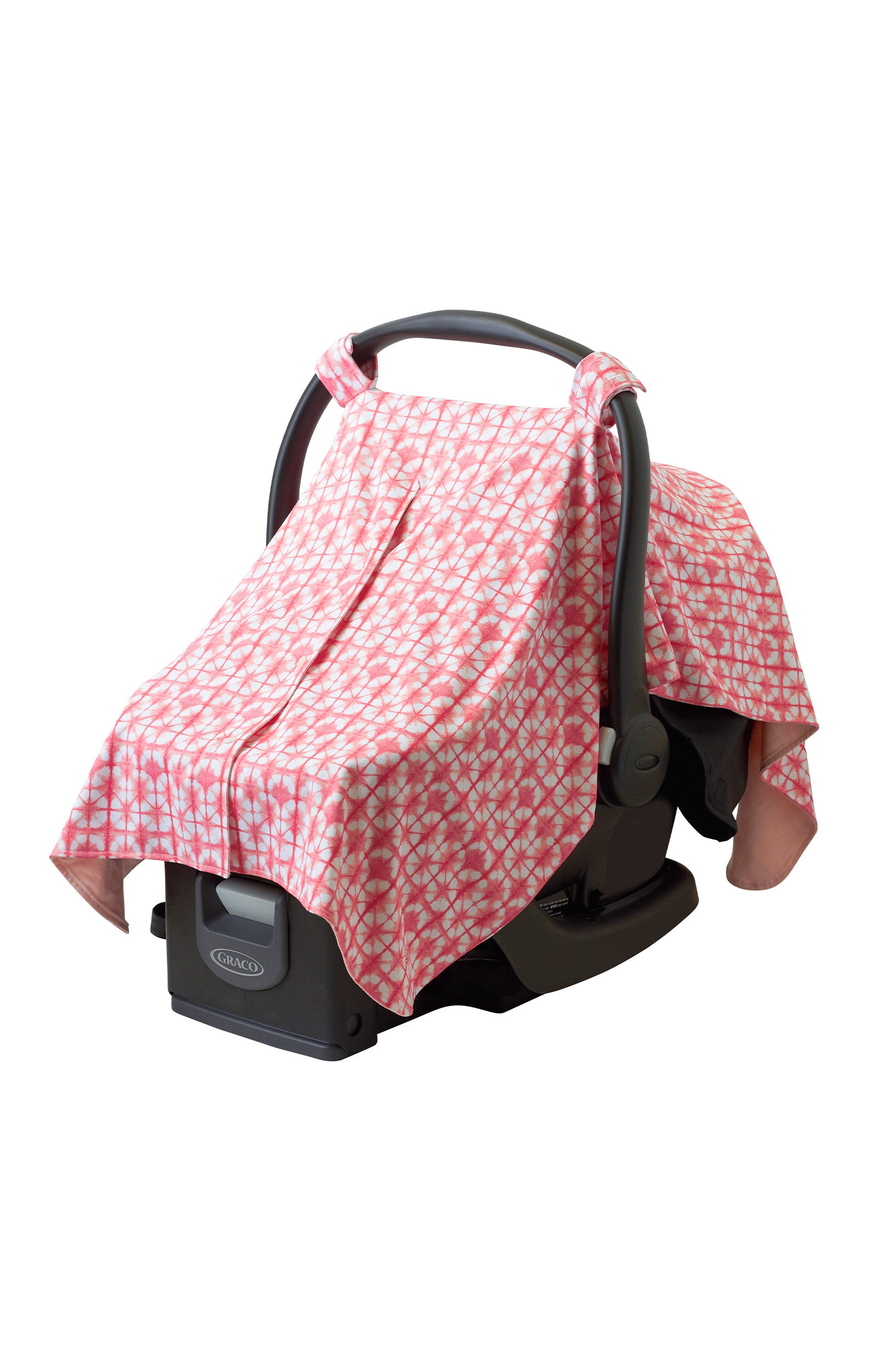 Sun protective car seat cover for babies in tie dyed pinks over a car seat|tie-dyed-pinks