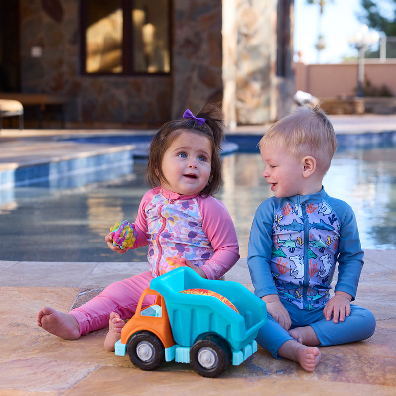 baby girl baby boy playing by pool with toys in swim leggingz|baltic-reef-shark