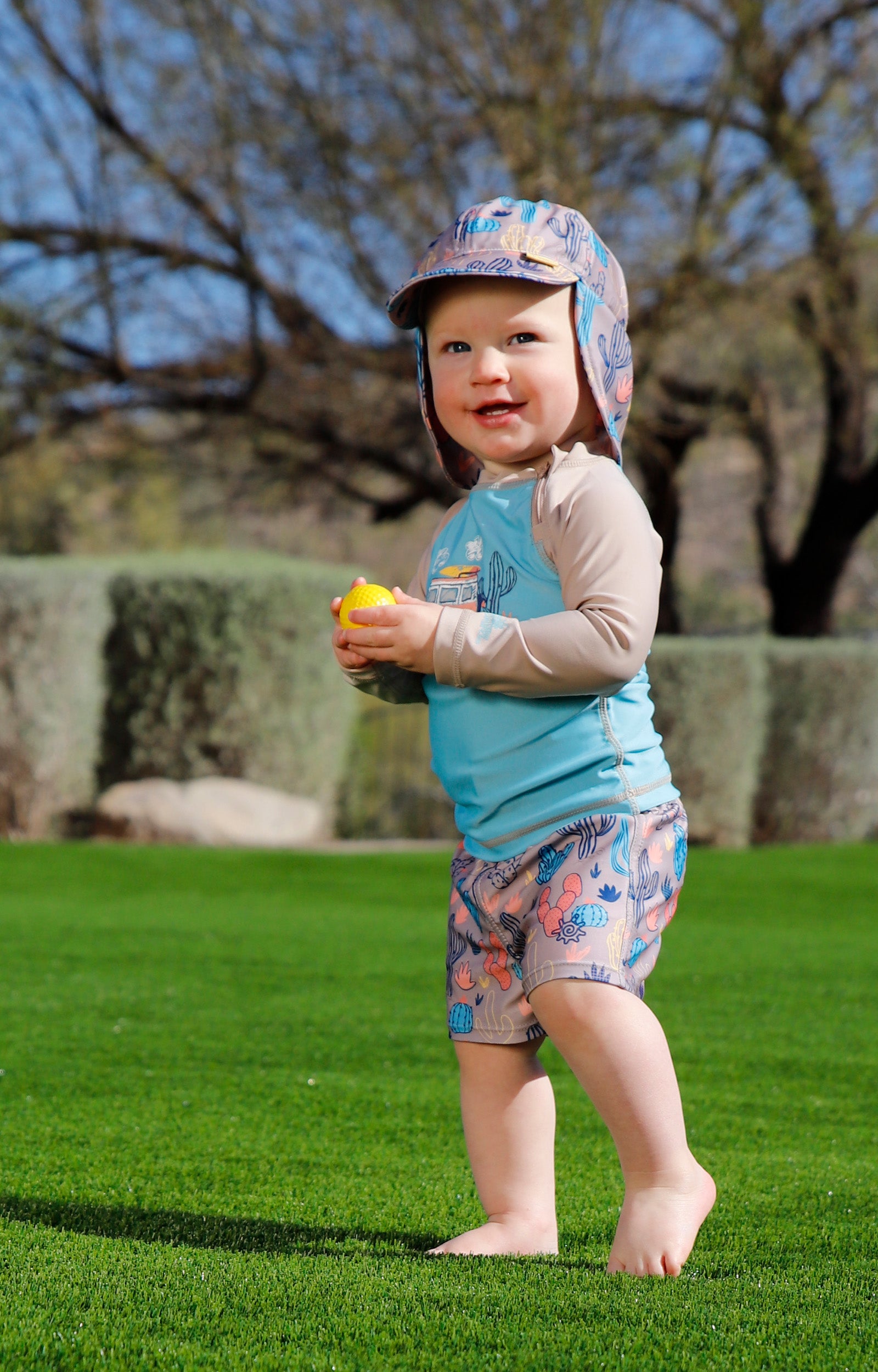 baby in swim shorties|cactus-crowd