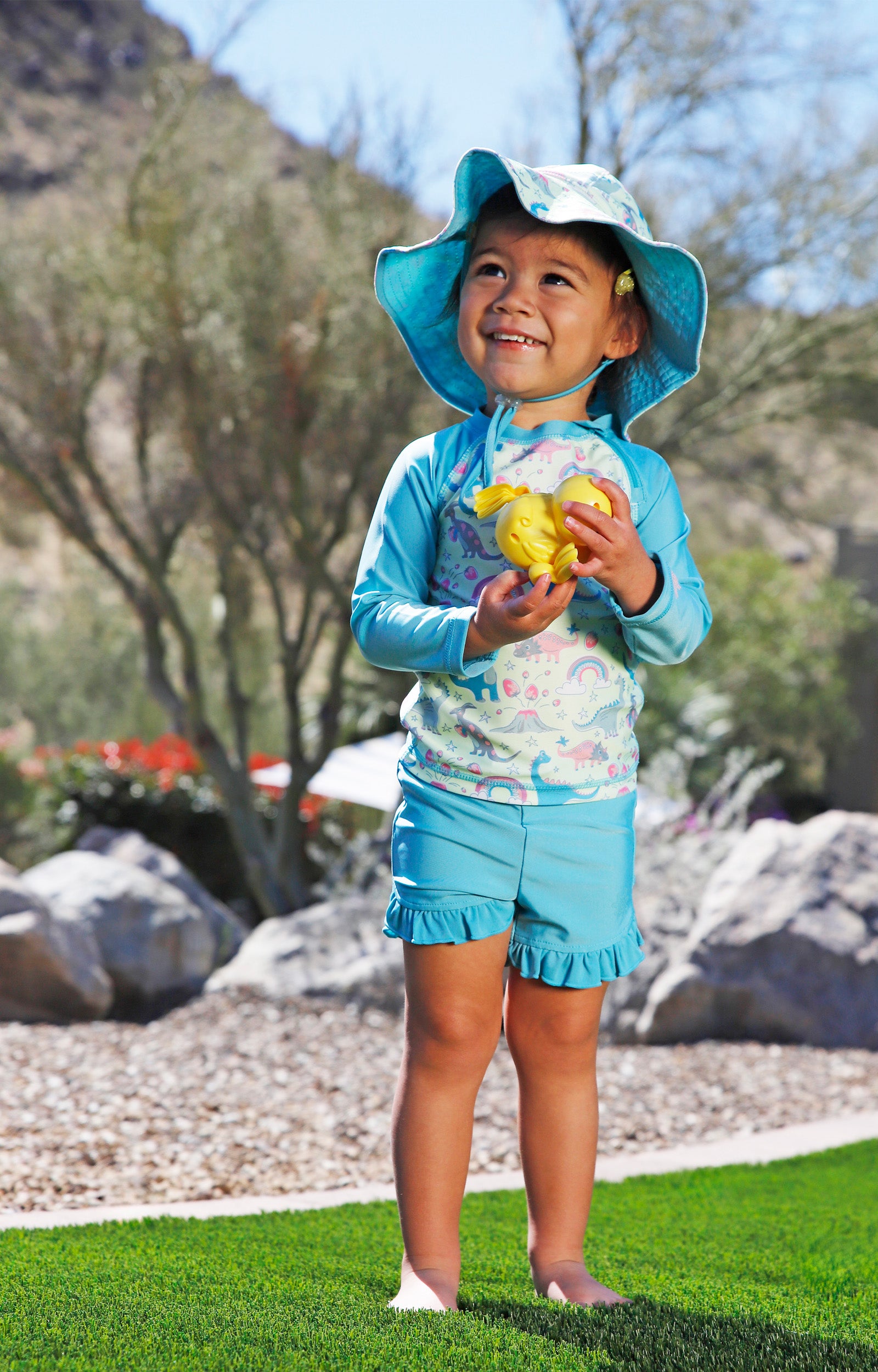 baby in zippy long sleeve sun and swim shirt|dino-berry