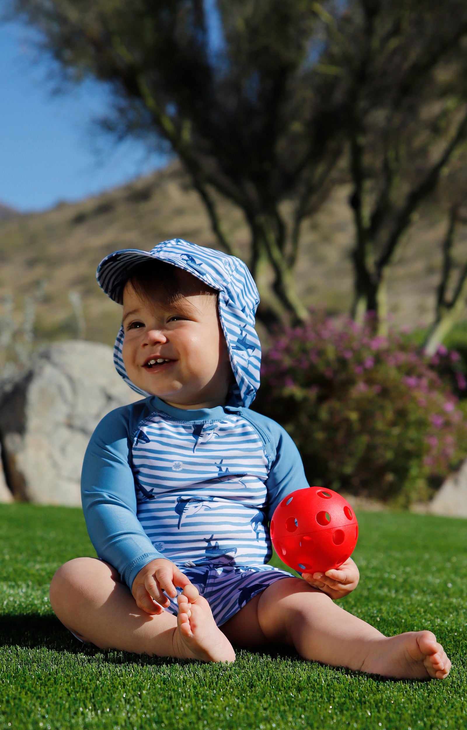 baby in long sleeve zippy sun and swim shirt|shark-stripe