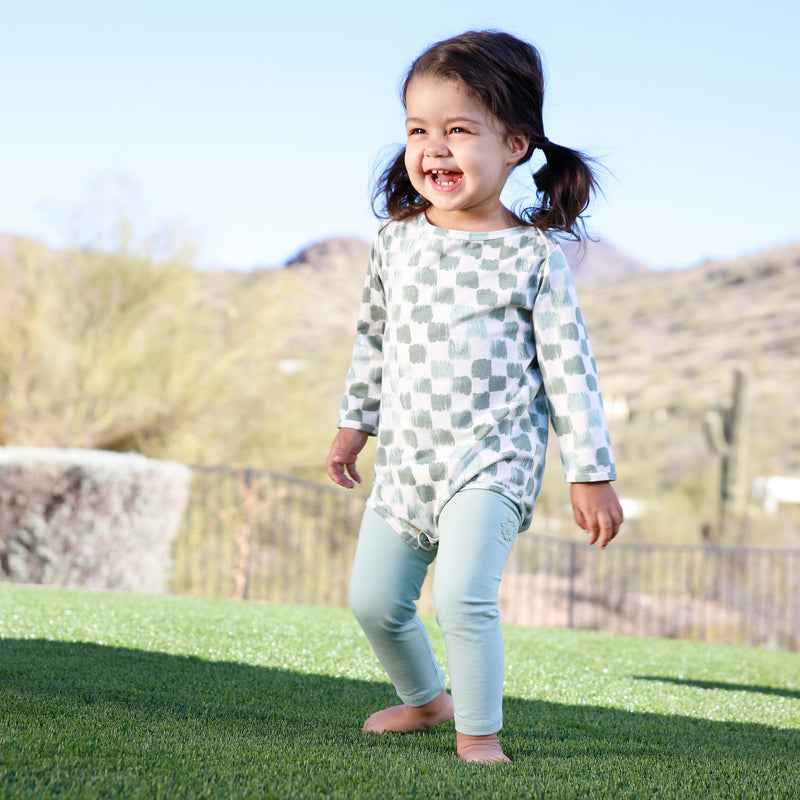 baby playing in bamboo sun legz|frosty-green